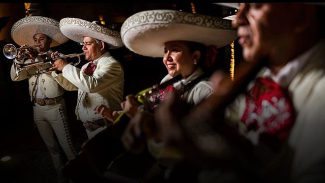 A mariachi band performing traditional Mexican patriotic songs